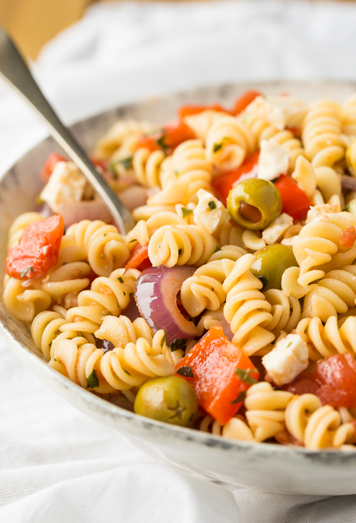Calabrese pasta salad is a wonderful pasta dish featuring roasted red peppers served either warm or cool as a side dish or entrée.