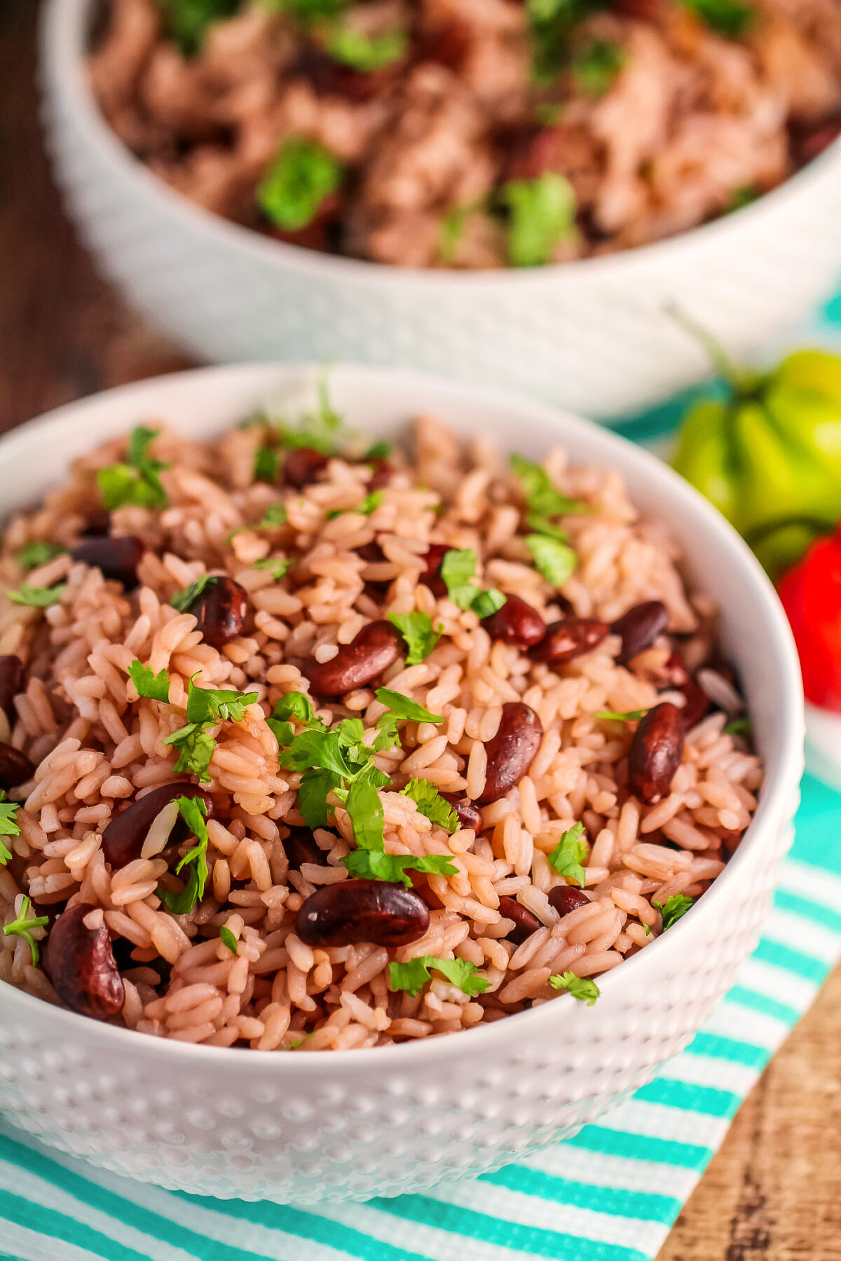 This Jamaican Rice and Peas recipe is an authentic recipe for the traditional Jamaican side dish featuring fragrant thyme and coconut milk! 