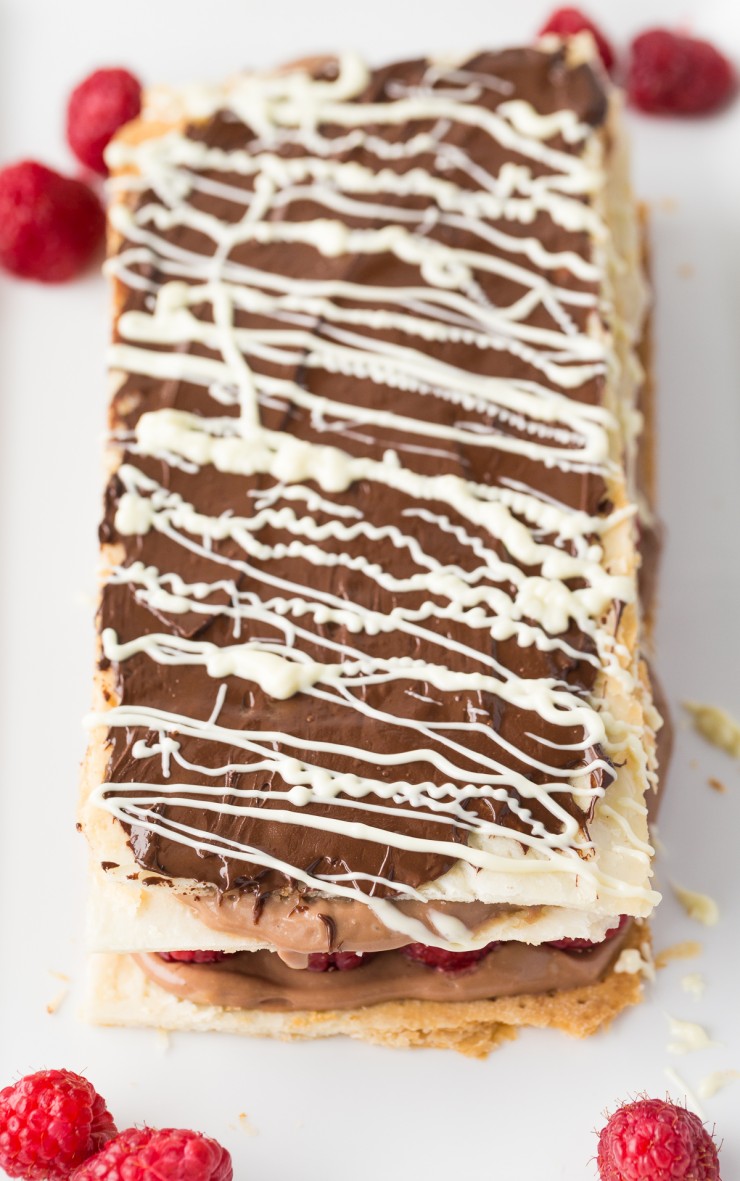 Make a decadent bakery shop treat at home with this indulgent recipe for a Chocolate and Raspberry Napoleon. Fresh raspberries stud chocolate pastry cream layered between airy sheets of puff pastry in this chocolate-raspberry dessert. A match made in heaven! 