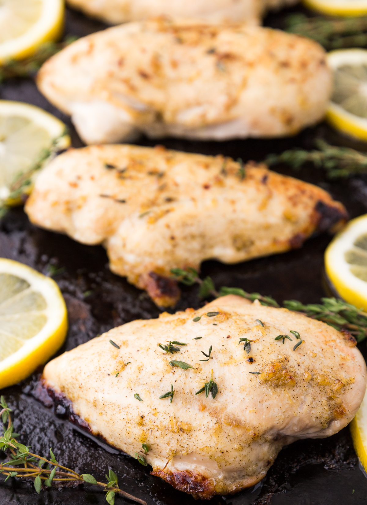 Juicy grilled lemon thyme chicken breasts marinated with fresh lemon, garlic, honey, and herbs. An easy chicken dinner perfect for the grill.