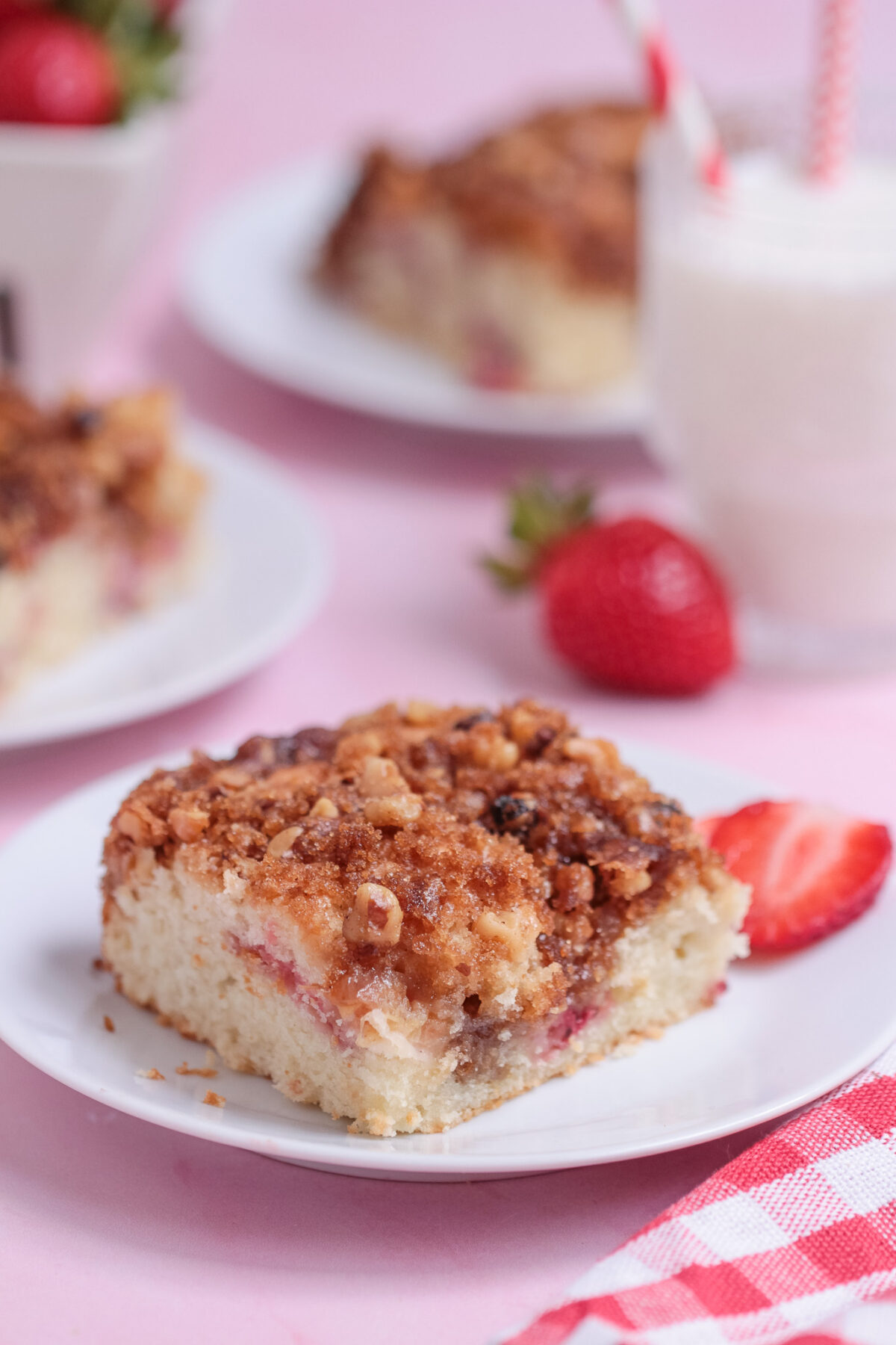 Moist Strawberry Rhubarb Coffee Cake with a cinnamon walnut crumble topping. The perfect breakfast cake, brunch treat, or easy dessert.
