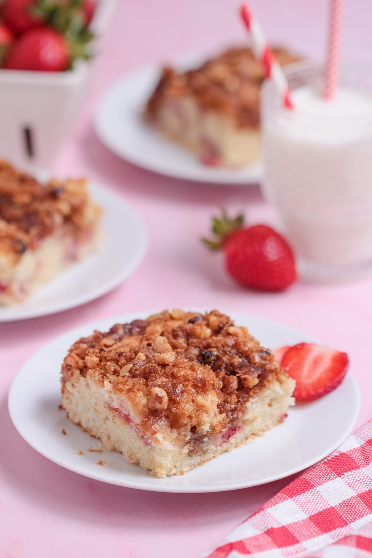 Moist Strawberry Rhubarb Coffee Cake with a cinnamon walnut crumble topping. The perfect breakfast cake, brunch treat, or easy dessert.