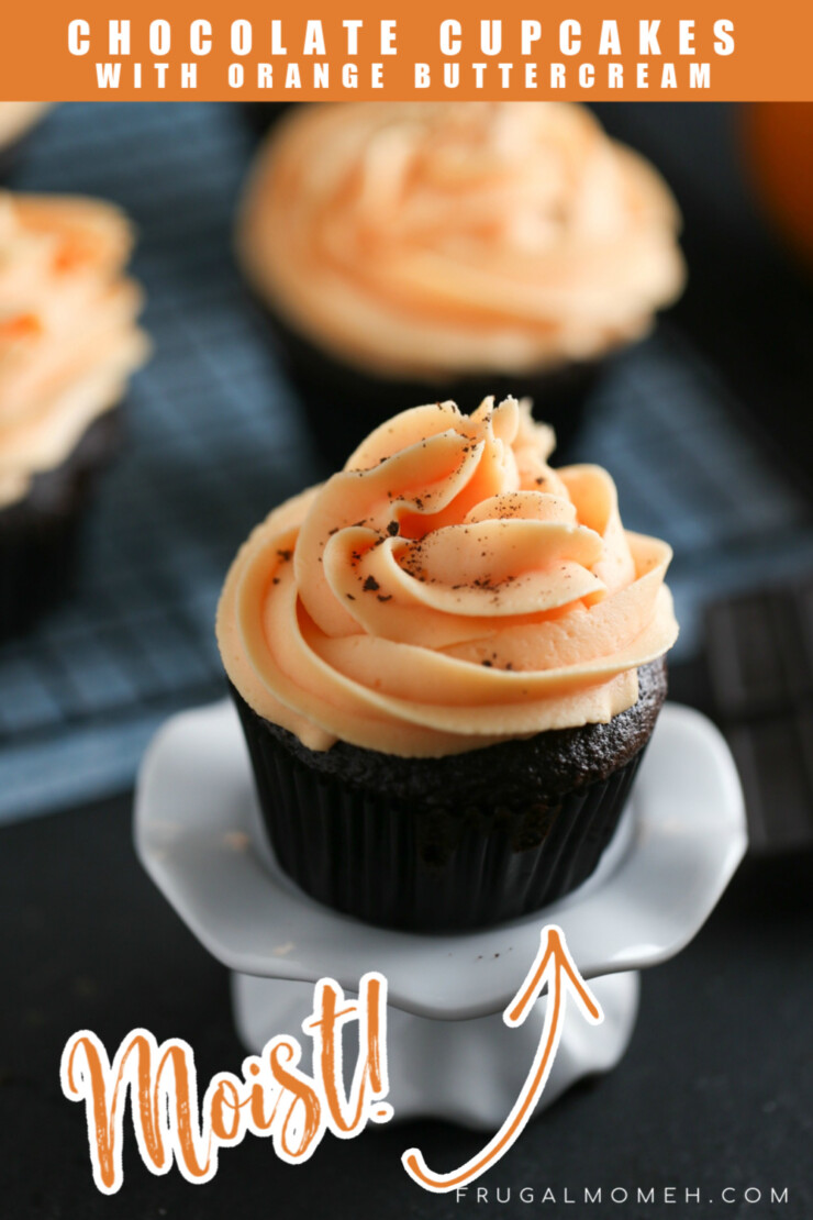 Moist and flavourful Chocolate Cupcakes topped with bright Orange Buttercream Frosting.