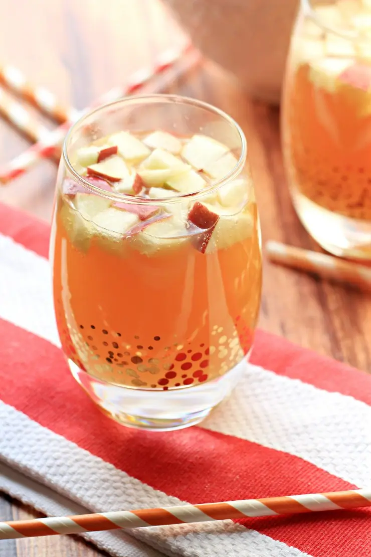 This Non Alcoholic Apple Pie Punch is the perfect virgin drink for fall and thanksgiving! Strain the apples and it is a kid-friendly punch too! 