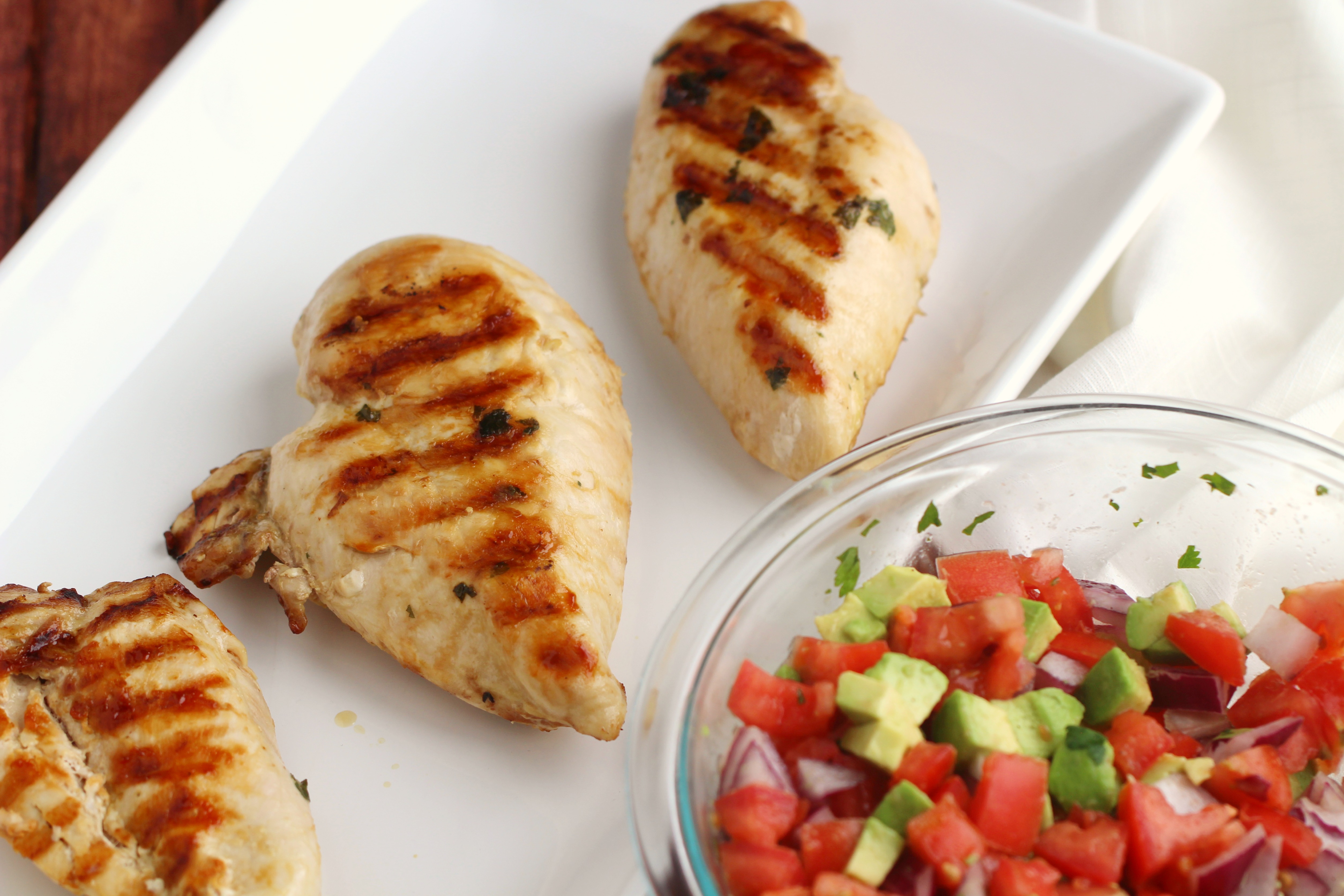This Cilantro Lime Chicken with Fresh Avocado Salsa is delicious served with rice for a fresh tasting family dinner. It's also a heart healthy recipe!