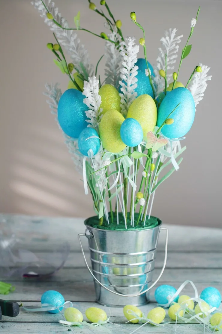 This Easy Easter Egg Flower Arrangement can be put together on a dime from Dollar Store supplies - but it's so gorgeous nobody will know!