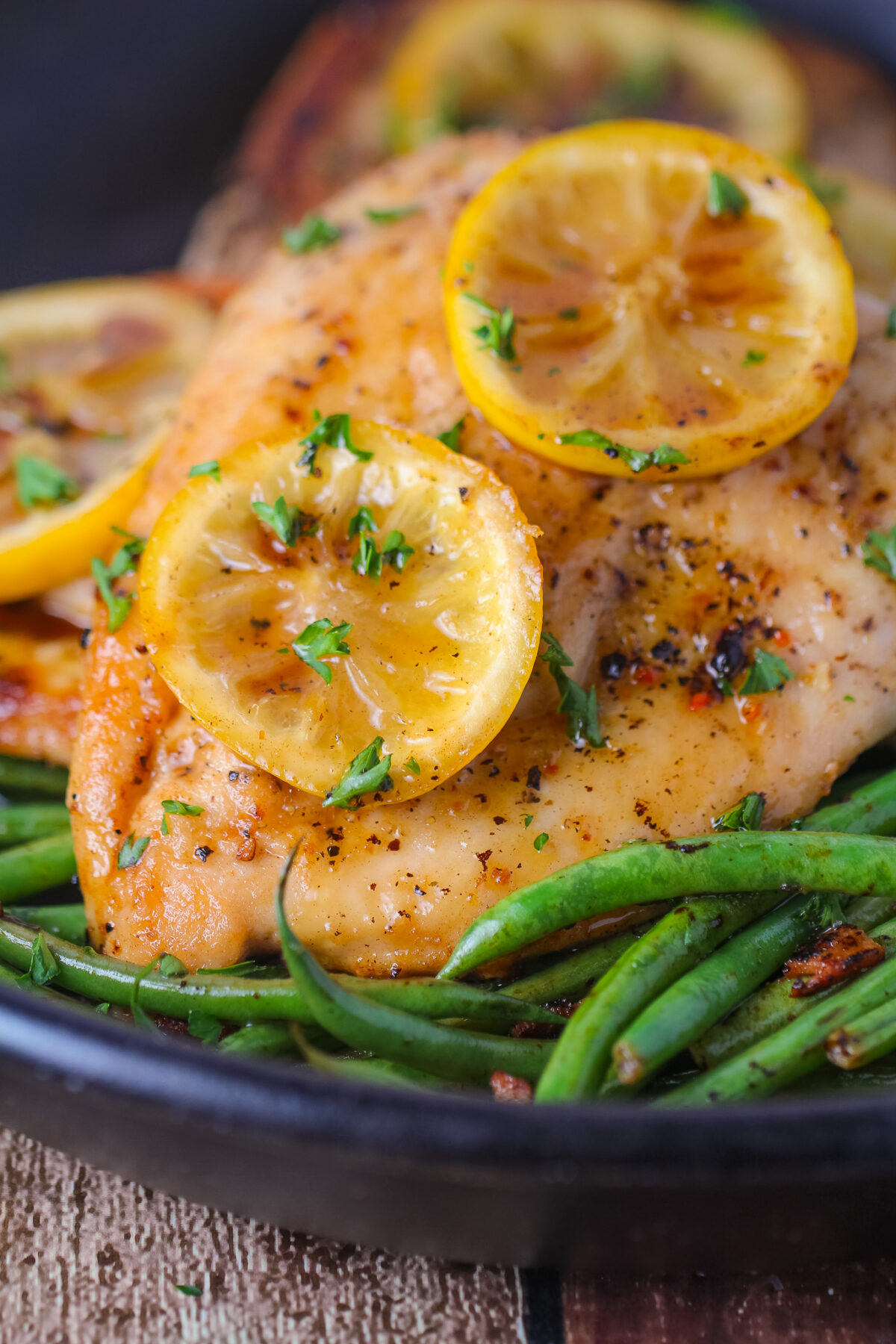 Easy lemon pepper chicken made in one pan with fresh lemon, honey, butter, and herbs. Juicy pan-fried chicken breasts ready in 30 minutes.