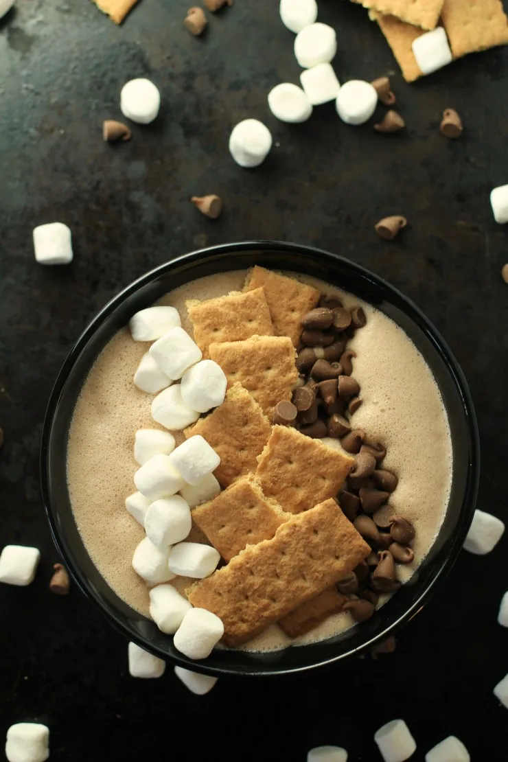This S'mores Smoothie Bowl is a fun way for everyone to enjoy the taste of a summer camping recipe classic at home.  Your family is going to love this quick and easy dessert recipe!