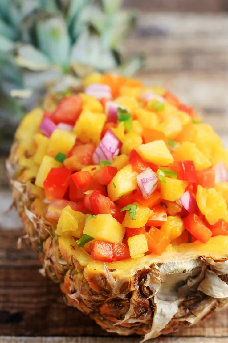 This sweet & spicy pineapple salsa recipe is super easy and full of incredible fresh flavours. Serve it with tortilla chips for a fresh summer appetizer or as a topping for grilled chicken or fish.