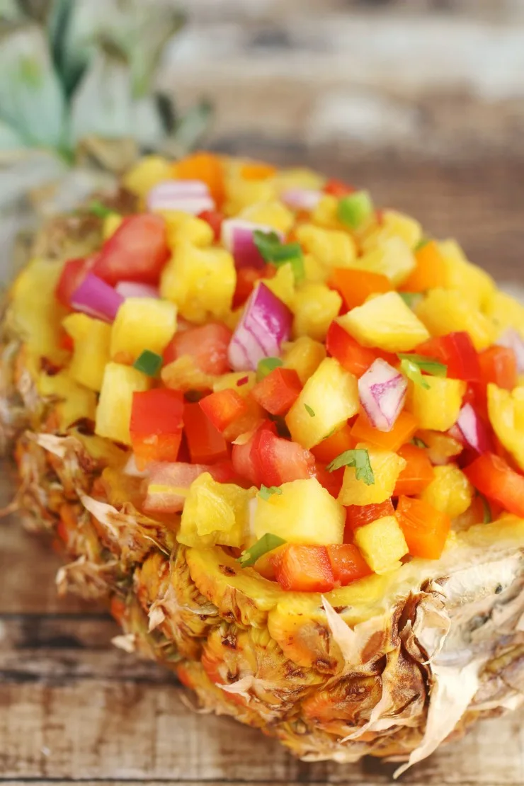 This sweet & spicy pineapple salsa recipe is super easy and full of incredible fresh flavours. Serve it with tortilla chips for a fresh summer appetizer or as a topping for grilled chicken or fish.