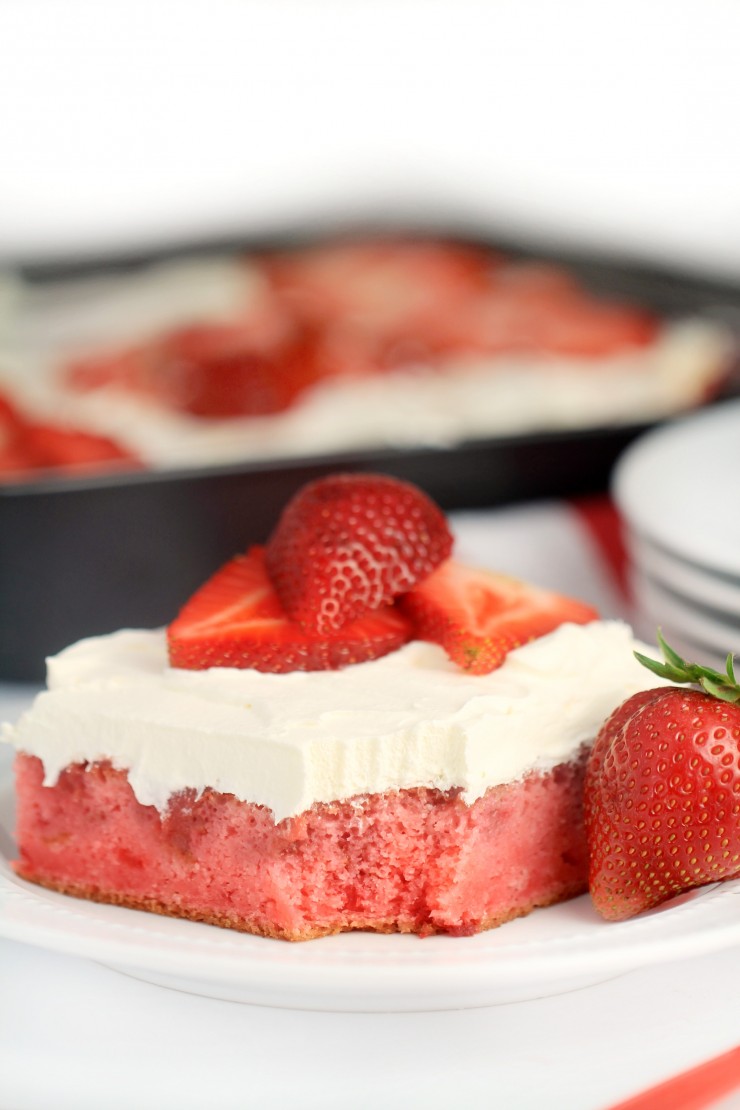 This strawberry poke cake is a delicious twist on that classic summer treat - strawberry shortcake. Fresh strawberries make this the most delicious strawberry cake you've ever had!