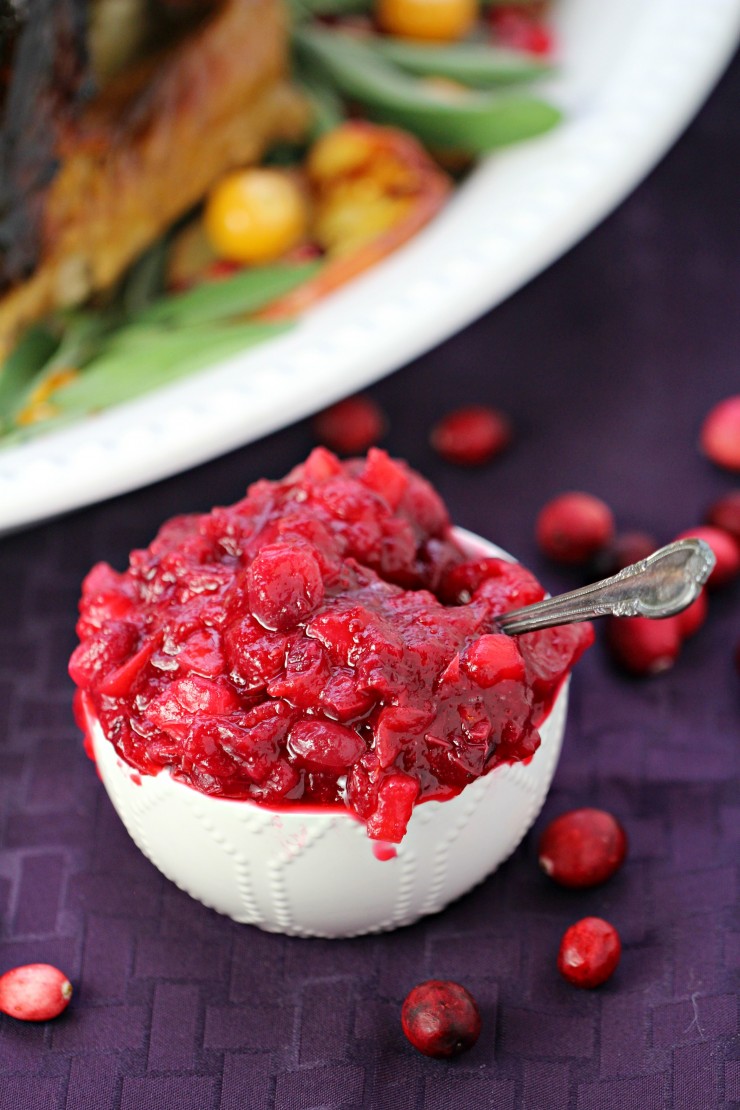 Update your Homemade Cranberry Sauce with apples and spice for an easy twist on the classic Thanksgiving side dish. This would be great for Christmas dinner too!