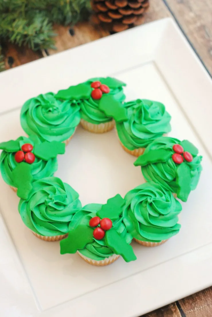 This Pull-Apart Christmas Wreath Cake is super simple but turns out really cute. Perfect for any holiday party, this cake is sure to be a hit!