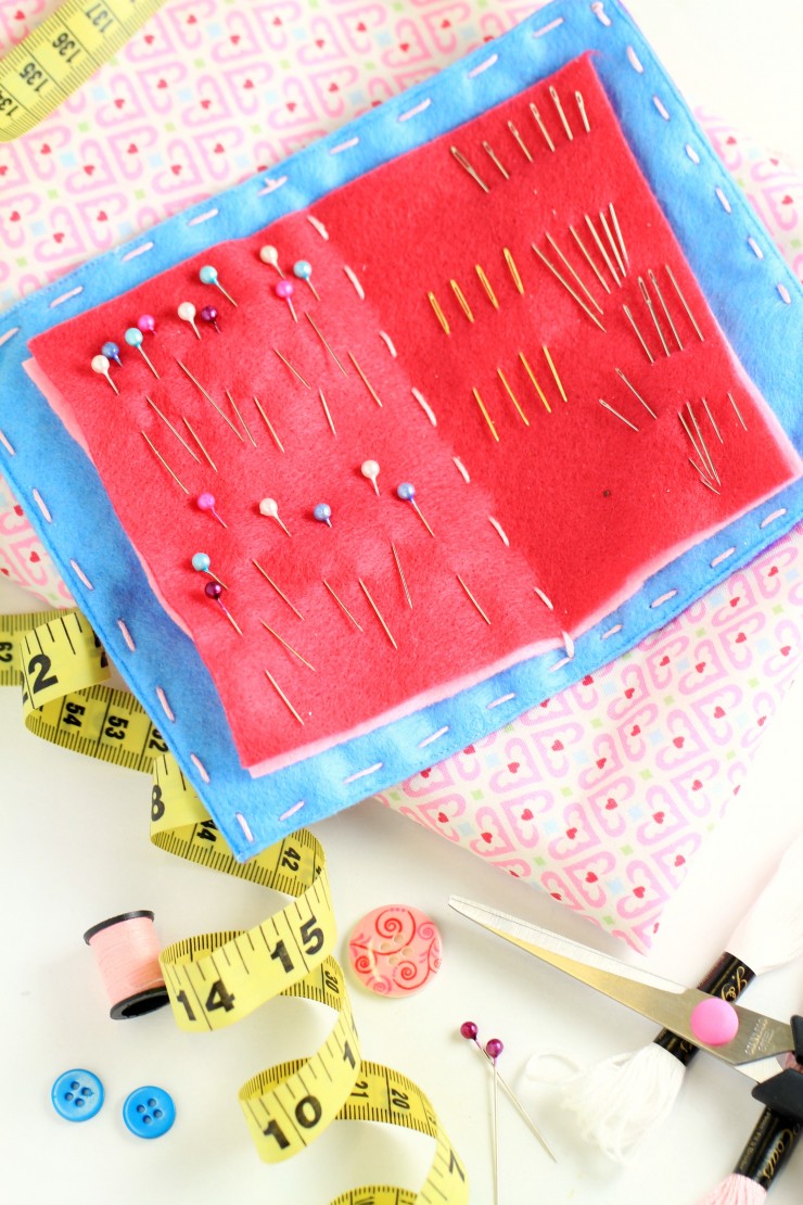 Keep your pins and needles on hand and completely organized in this beautiful handmade felt needle case. A great gift idea for anyone who loves sewing, it is designed like a book with a cover and pages inside for holding pins and needles.
