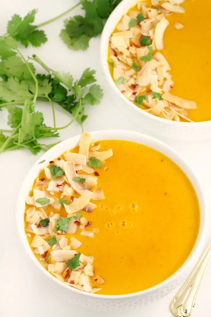 A curried, creamy butternut squash soup made with Thai inspired ingredients like ginger, coconut and lemongrass. This Thai Coconut Butternut Squash Soup then gets topped off with toasted coconut and cilantro for an amazing finish.