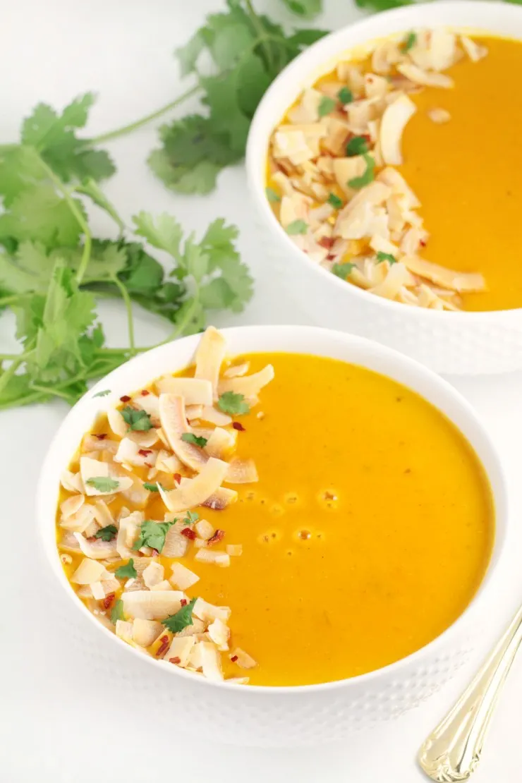 A curried, creamy butternut squash soup made with Thai inspired ingredients like ginger, coconut and lemongrass. This Thai Coconut Butternut Squash Soup then gets topped off with toasted coconut and cilantro for an amazing finish.