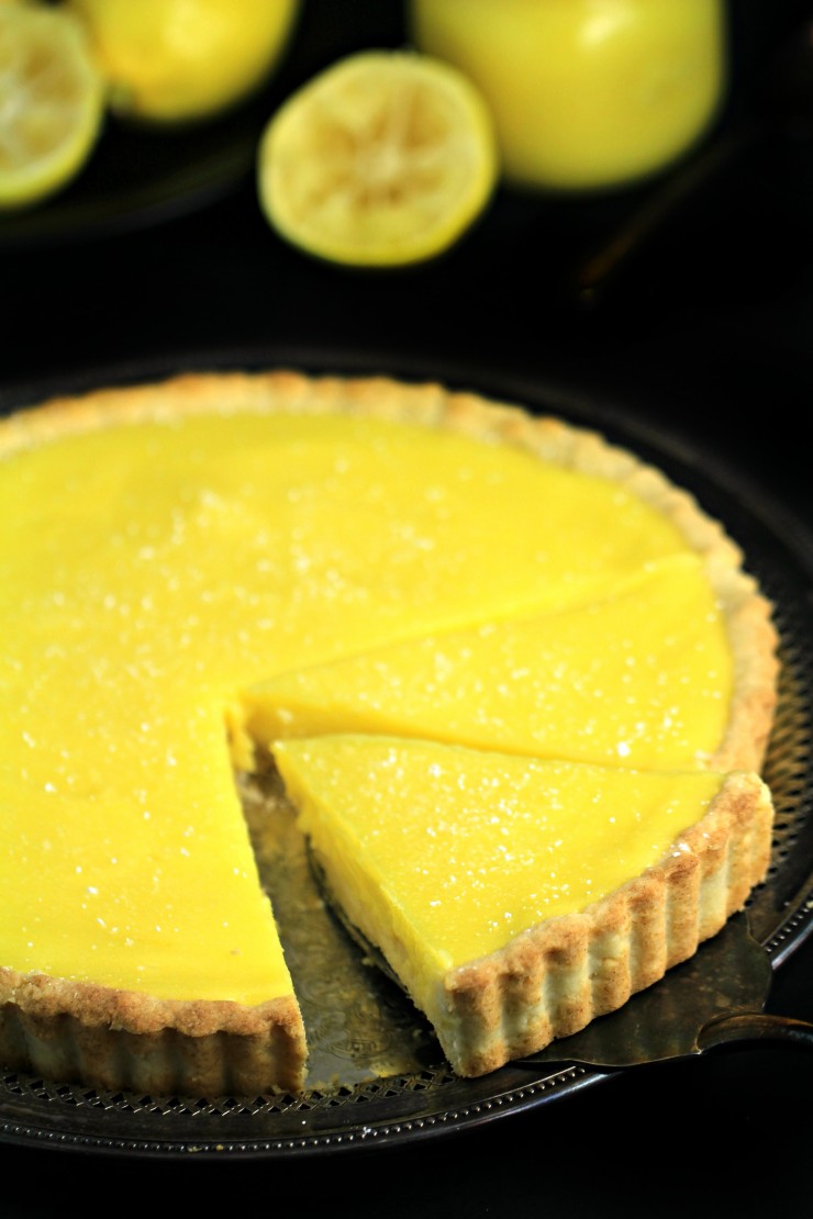 Tart and tangy this lemon tart is deliciously sweet with a shortbread crust that is to die for. This is an impressive from-scratch dessert that is creamy, delicious and easy! 