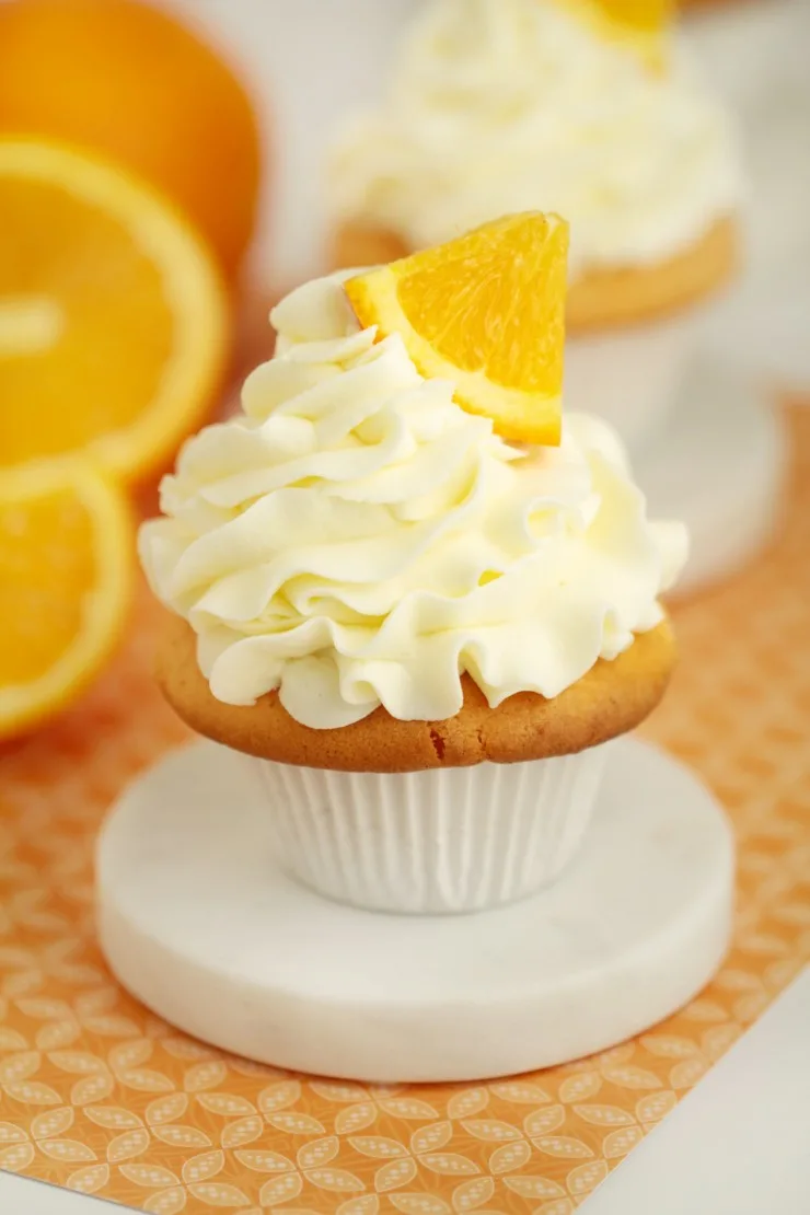 I love doctoring box cake mixes and quite frankly this doctored cake mix recipe for orange crush cupcakes is the bomb. It's got bright citrus flavours and results in a divine, fluffy cupcake.