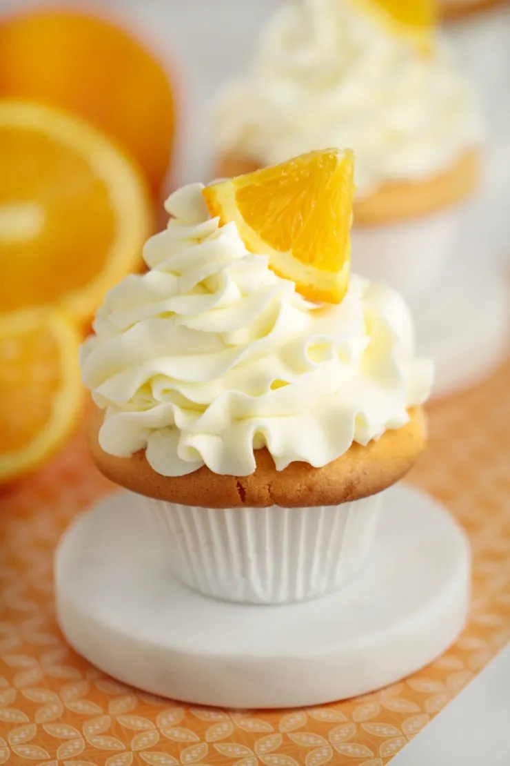 I love doctoring box cake mixes and quite frankly this doctored cake mix recipe for orange crush cupcakes is the bomb. It's got bright citrus flavours and results in a divine, fluffy cupcake.