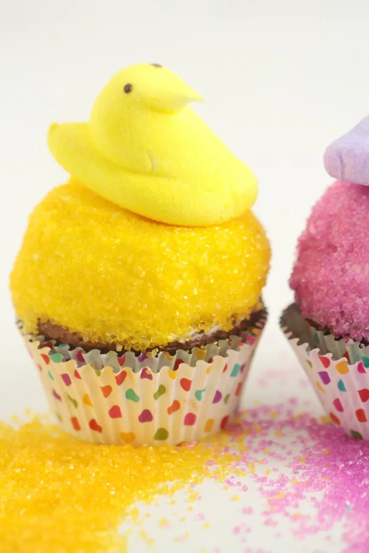 These Easter Peeps Cupcakes are just the sweetest Easter cupcakes and they are so easy to make! My kids love the peeps and colourful sanding sugar on a carrot cupcake. 