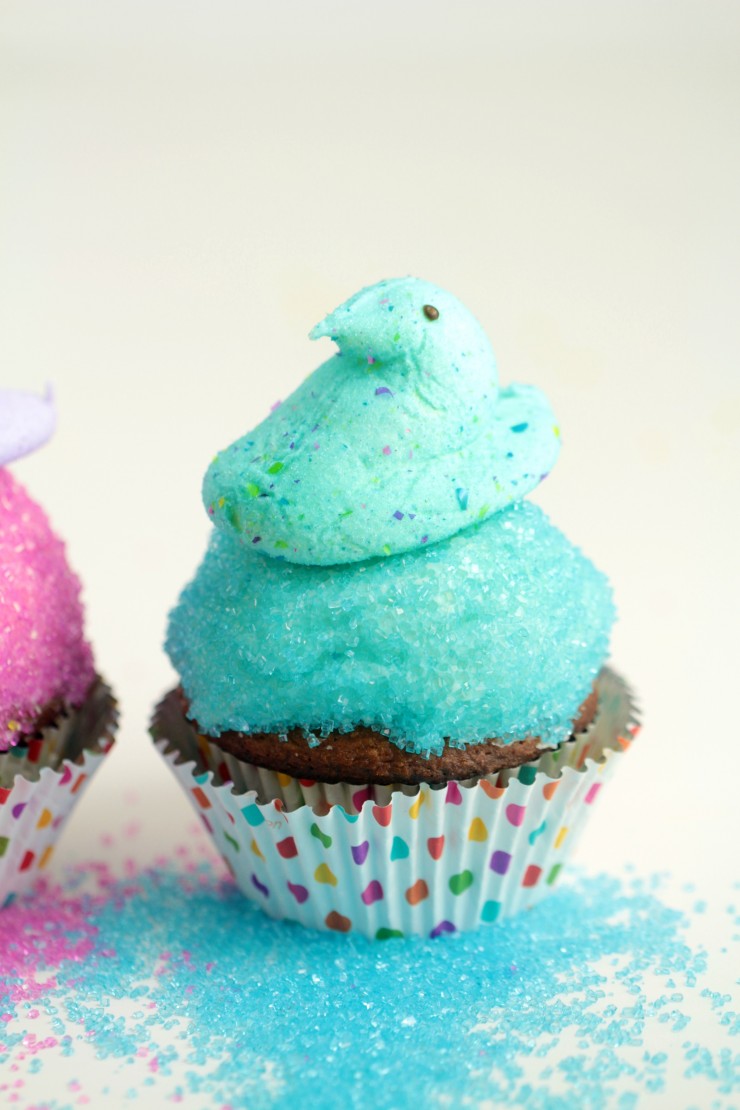 These Easter Peeps Cupcakes are just the sweetest Easter cupcakes and they are so easy to make! My kids love the peeps and colourful sanding sugar on a carrot cupcake. 