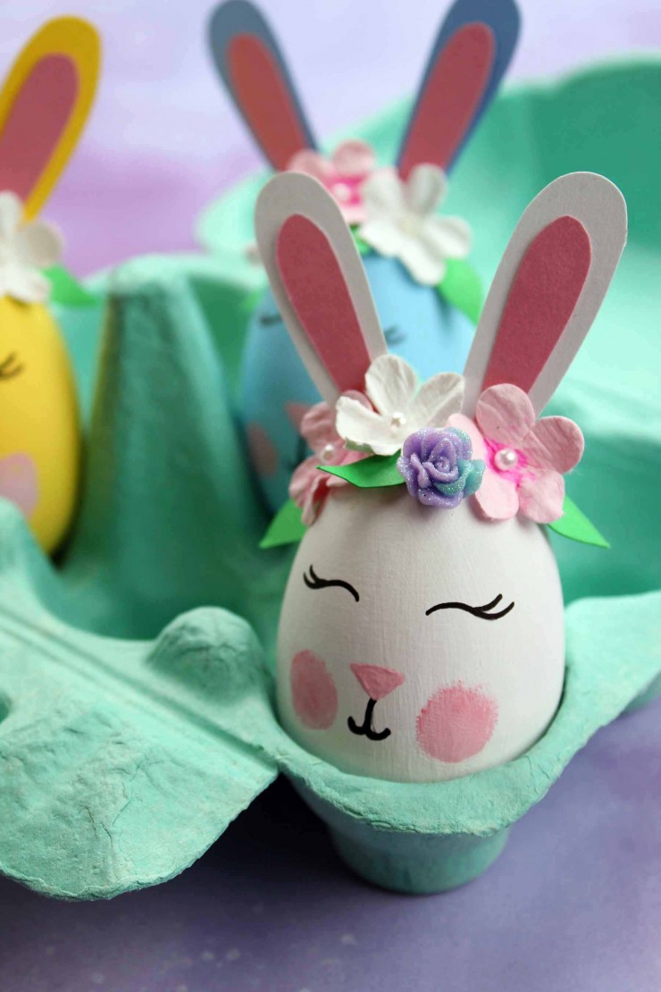 These Bunny Easter Eggs are an easy Easter craft that results in adorable home décor for the Easter season. These bunnies are just the cutest with their floral crowns and rosy cheeks!