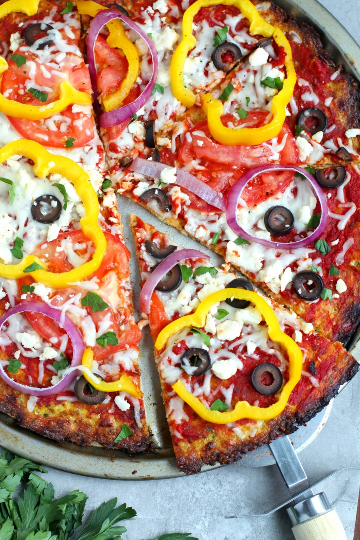 This low carb Mediterranean Cauliflower Pizza is a delicious and healthy twist on a family favourite. The crisp flavourful crust is sure to be a hit! 