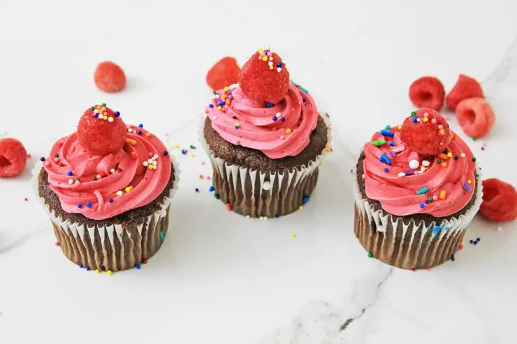 These raspberry cupcakes will take you back to summer time - they're so good, easy to make, and a real treat everyone is sure to love with a juicy, unexpected surprise inside. 