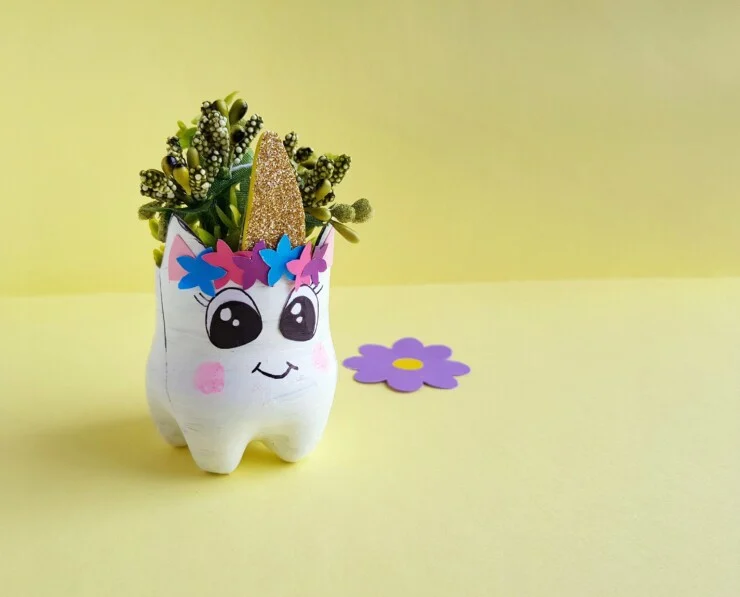 This Upcycled Unicorn Planter makes any space magical. This is a great bottle recycling craft for kids and adults alike!