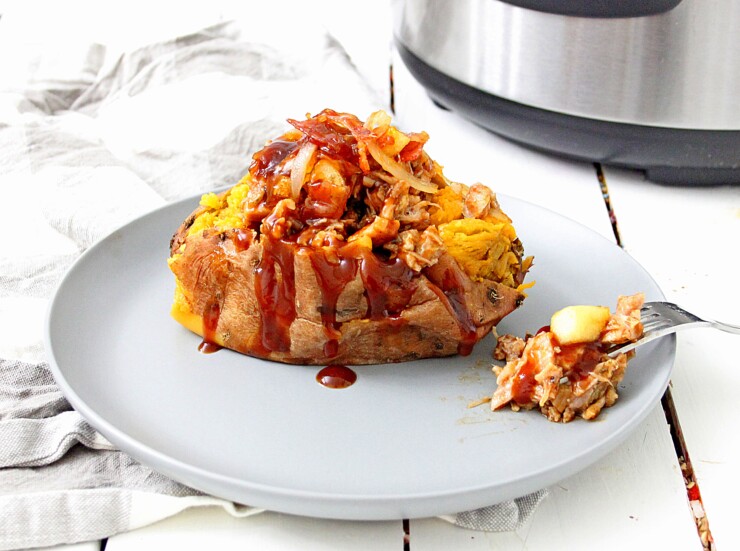 This Instant Pot Pulled Pork Stuffed Sweet Potatoes with Apple Bacon Jam features soft and creamy sweet potatoes cooked to perfection in the instant pot topped with pulled pork, onions, bbq sauce and an incredible apple bacon jam.