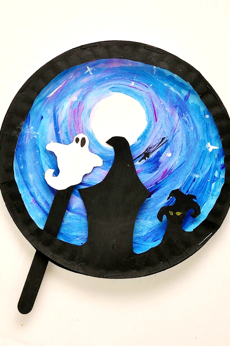 This fun Paper Plate Halloween Scene Puppet craft features a ghost or bat puppet that kids can move around a spooky backdrop. I love kids crafts that have a purpose after the craft is complete and this one really inspires imaginative play.