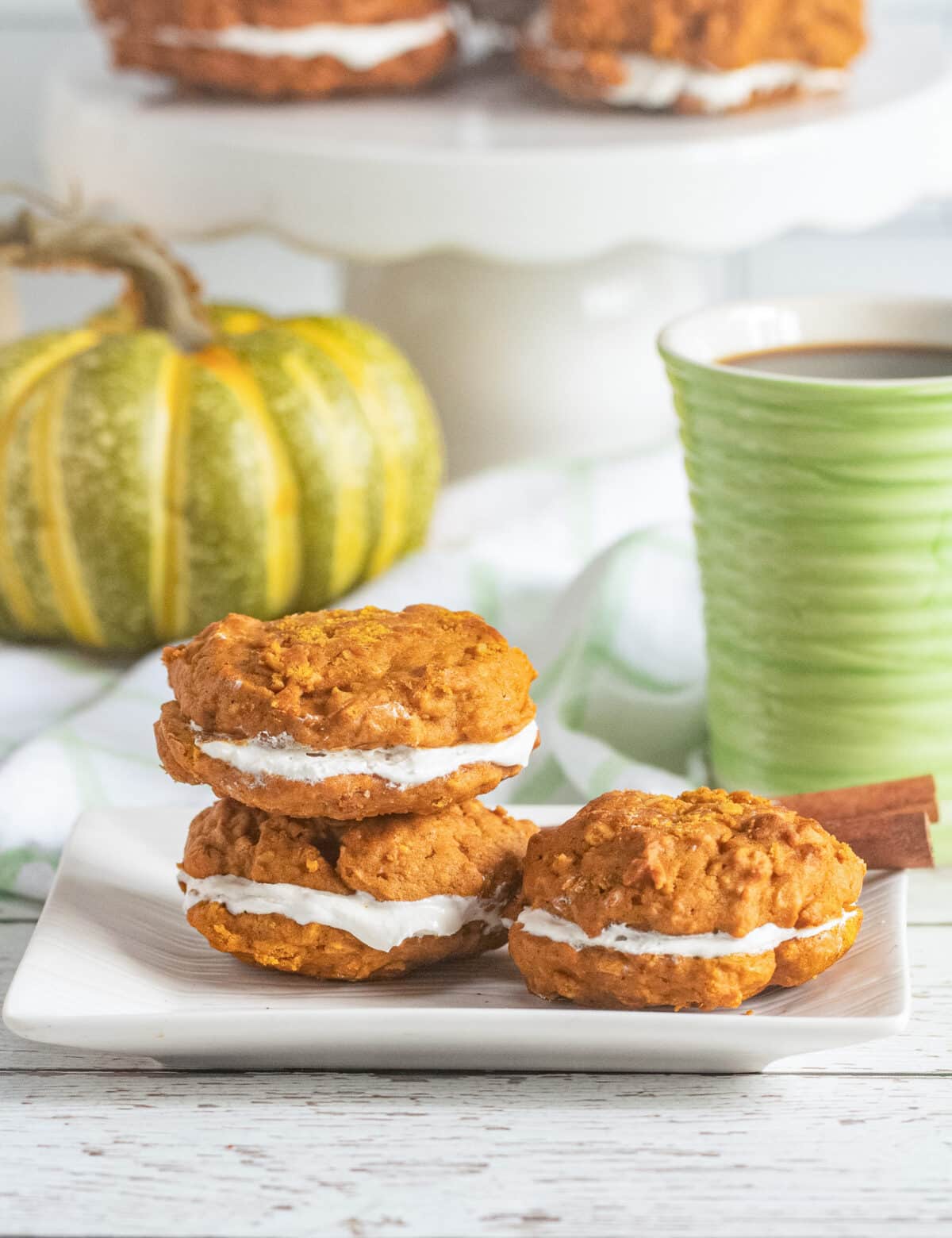 These Pumpkin Oatmeal Whoopie Pies feature soft, spiced pumpkin oatmeal cookies sandwiched with a fluffy marshmallow filling.