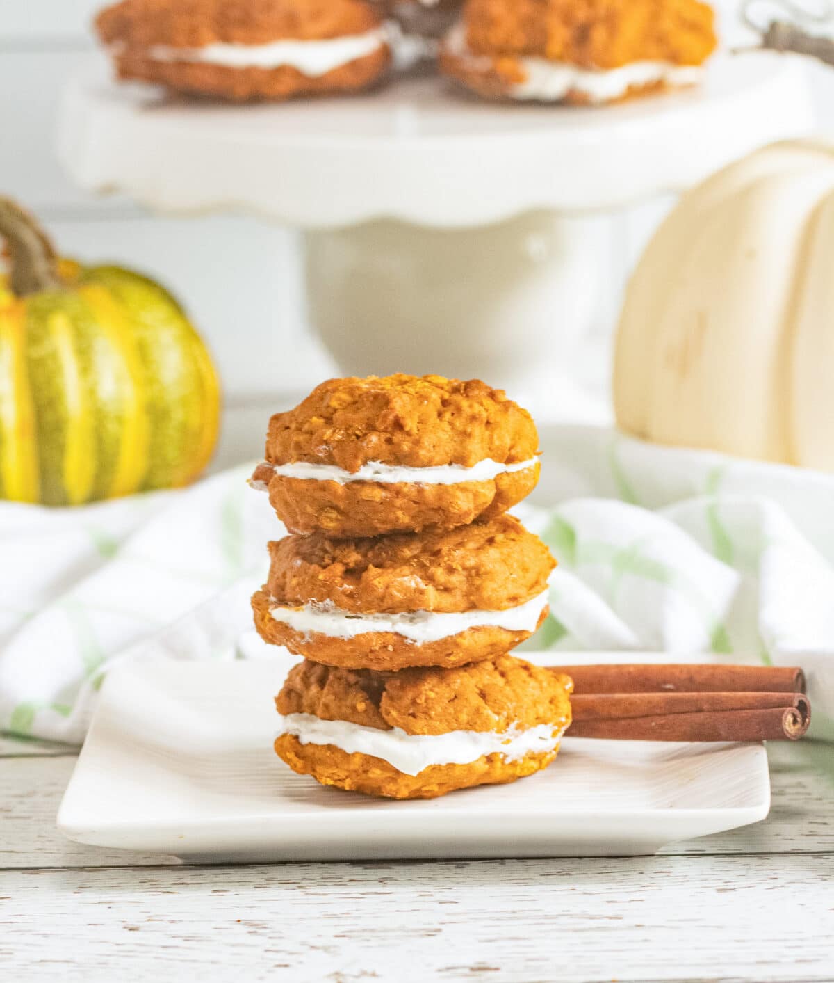 These Pumpkin Oatmeal Whoopie Pies feature soft, spiced pumpkin oatmeal cookies sandwiched with a fluffy marshmallow filling.