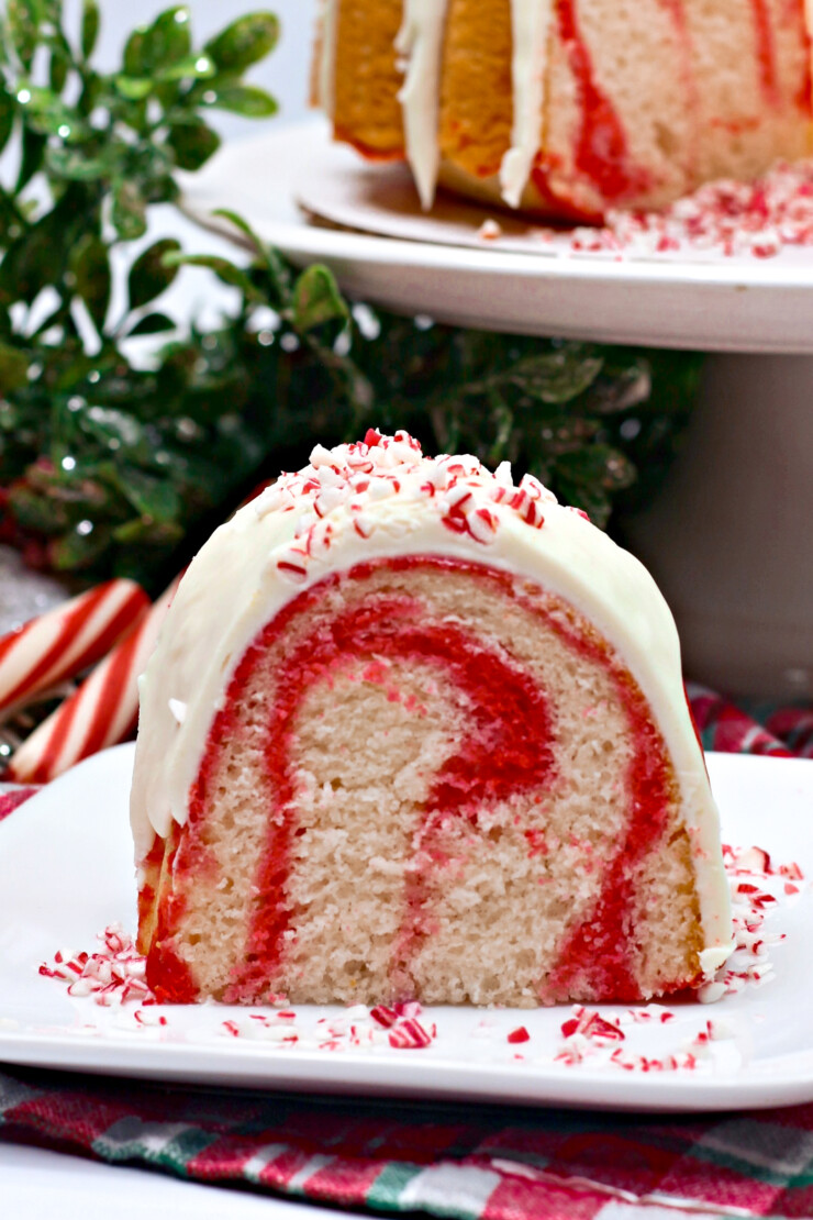   Oh so pretty and festive, this Candy Cane Bundt Cake is sure to wow guests you are entertaining this holiday season.