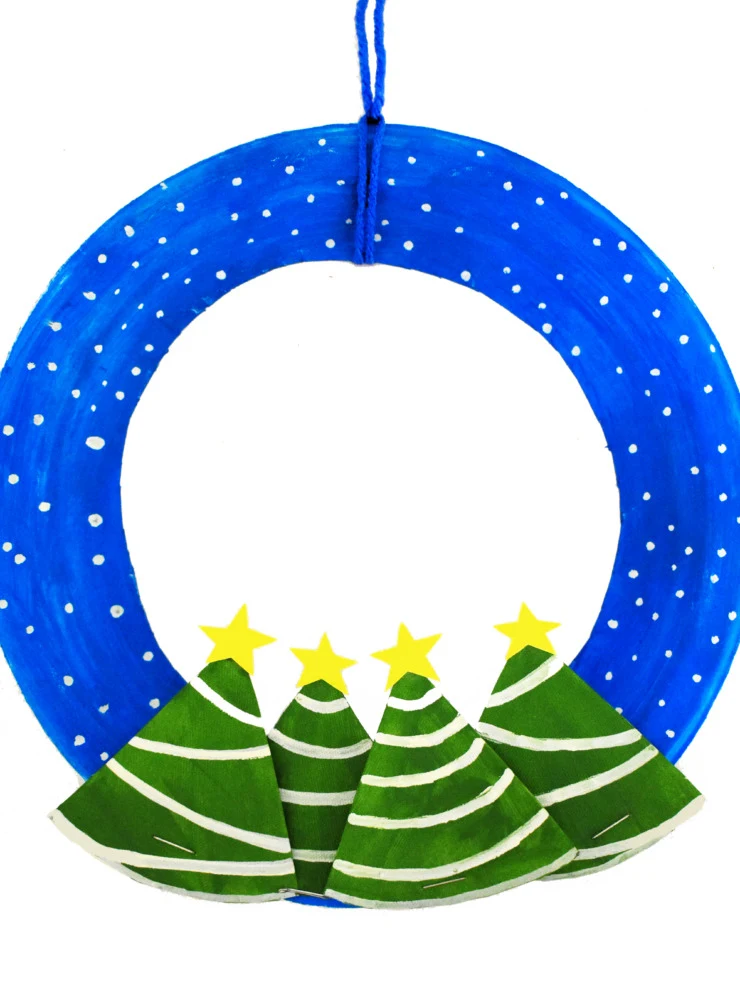 Get your kids into the holiday spirit with this festive Winter Wonderland Paper Plate Wreath craft. With just a paper plate, a little paint and basic craft supplies you can make your own Christmas wreath.
