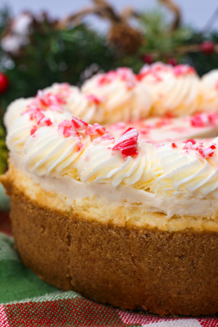 This peppermint white chocolate cheesecake gets topped with crushed candy canes and a sour cream topping to create a showstopping dessert.