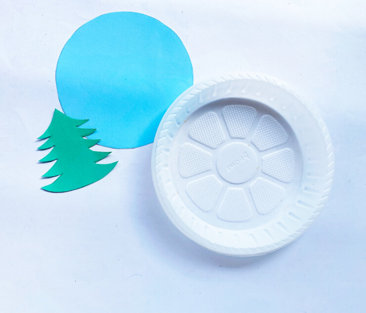 Paper plate, cut out paper tree, blue paper circle