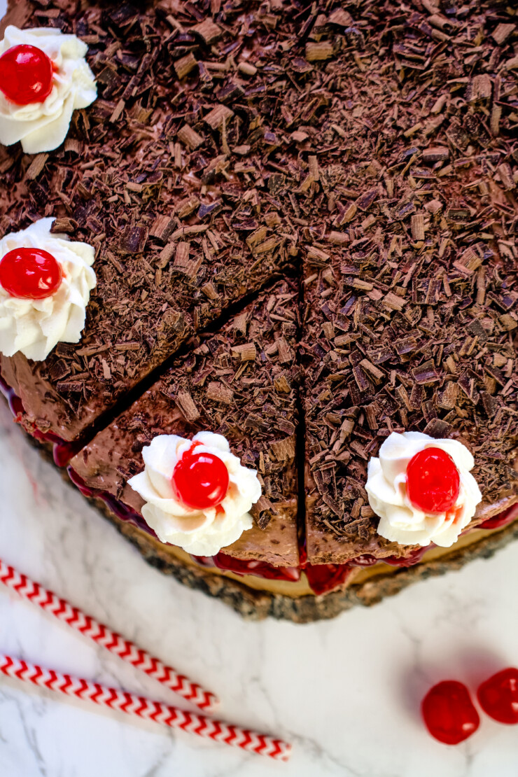 This No-Bake Black Forest Cheesecake features cherry pie filling between layers of creamy and light chocolate cheesecake filling.