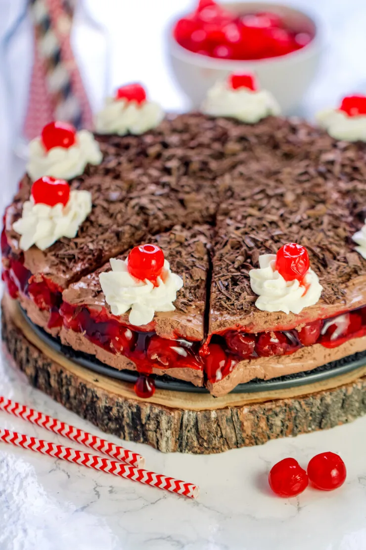 This No-Bake Black Forest Cheesecake features cherry pie filling between layers of creamy and light chocolate cheesecake filling.