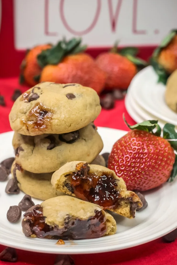 Classic chocolate chip cookies are filled with gooey strawberry jam in this Chocolate Covered Strawberry Cookies recipe. 