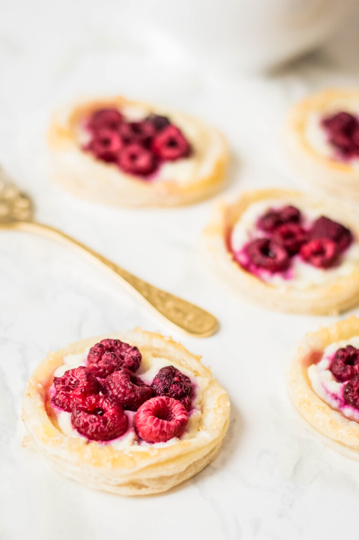 These Puff Pastry Raspberry Danishes are an easy to make breakfast pastry featuring fresh raspberries and a luscious ricotta filling.