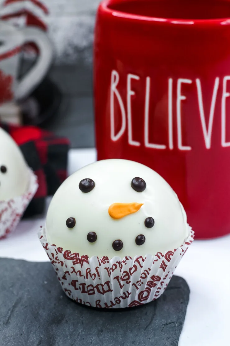 Make the cutest Snowman Hot Chocolate Bombs the easy way. Then drop them into a mug, pour over with hot milk and enjoy a rich hot chocolate.