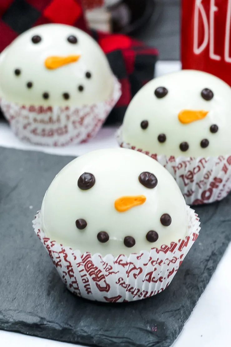 Make the cutest Snowman Hot Chocolate Bombs the easy way. Then drop them into a mug, pour over with hot milk and enjoy a rich hot chocolate.