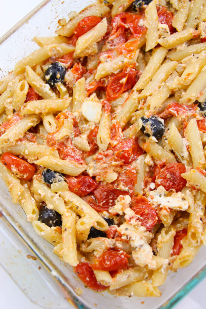 Finished Baked Feta Pasta with Cherry Tomatoes in casserole dish.