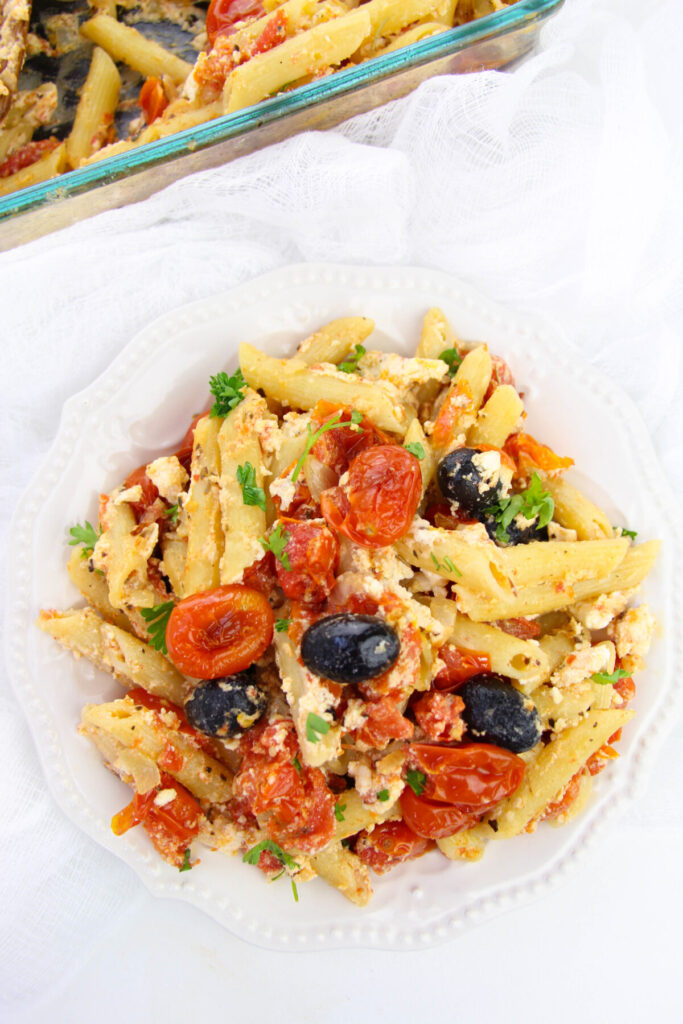 This Baked Feta Pasta with Cherry Tomatoes recipe is inspired by the TikTok famous cherry tomato pasta recipe. It's easy and delicious!