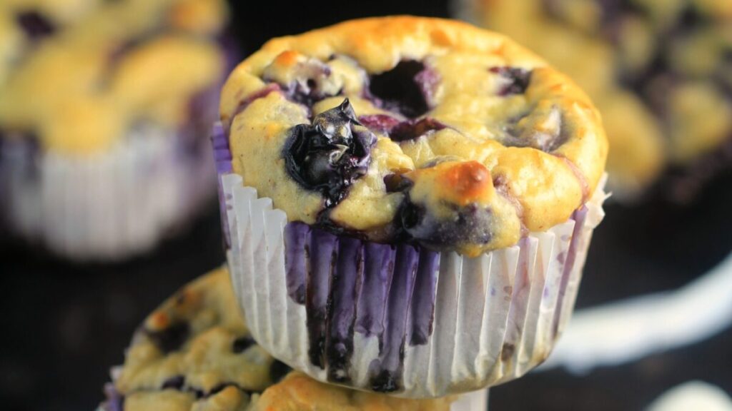These Blueberry Oatmeal Greek Yogurt Muffins are bursting with blueberries & oats for a healthy blueberry muffin with NO butter or oil!