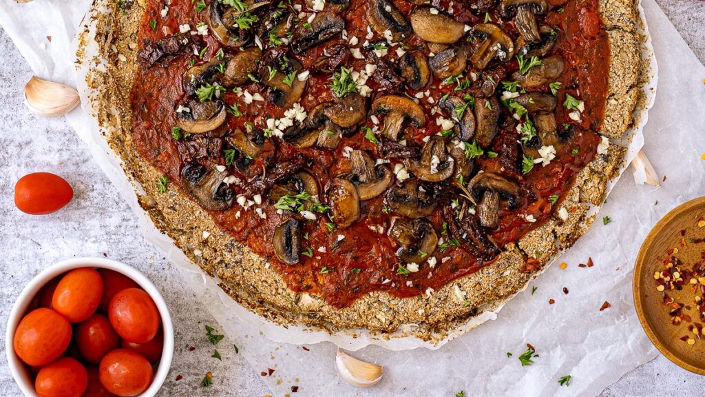 This Vegan Cauliflower Crust Pizza with Mushrooms is gluten-free, low carb, and has the best taste and texture.