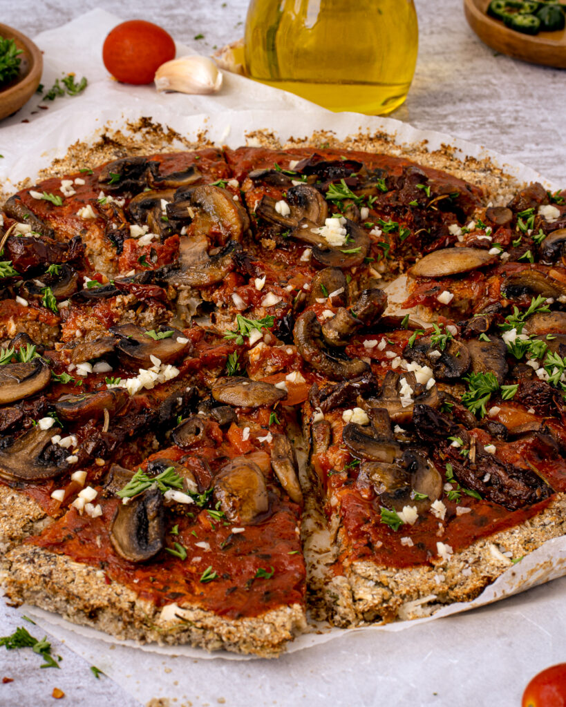 This Vegan Cauliflower Crust Pizza with Mushrooms is gluten-free, low carb, and has the best taste and texture.