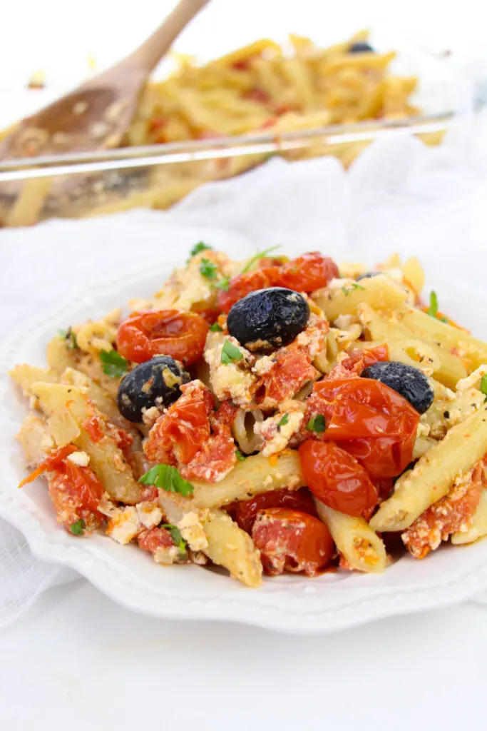 This Baked Feta Pasta with Cherry Tomatoes recipe is inspired by the TikTok famous cherry tomato pasta recipe. It's easy and delicious!