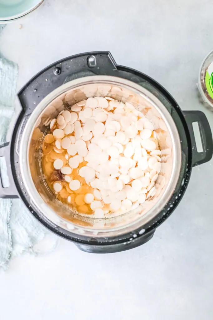 Butter, pecans and white chocolate inside instant pot 